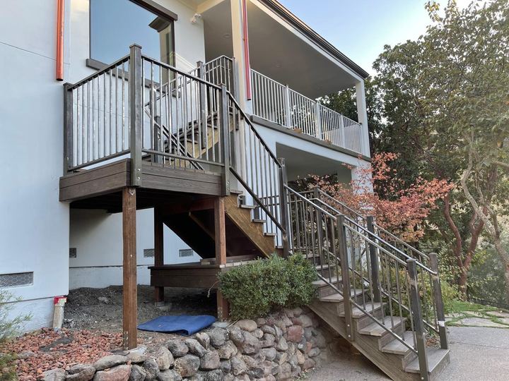 Welded exterior stair rails, balcony guards, posts, and metal connections.