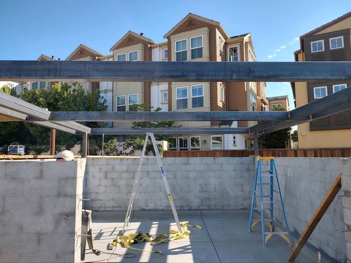 Custom steel framing and welded support work for exterior projects.