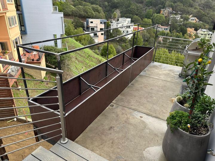 Custom steel planter box fabrication for an exterior balcony and hillside property.