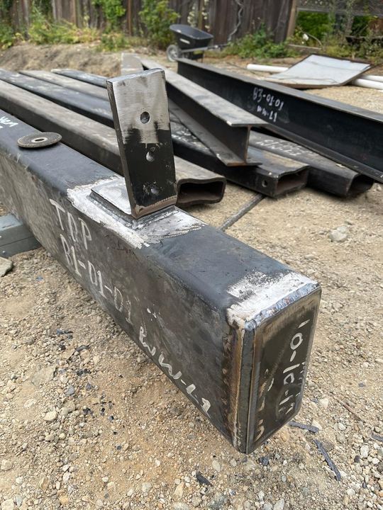 Base plate, post, bracket, and connection welding for steel supports.