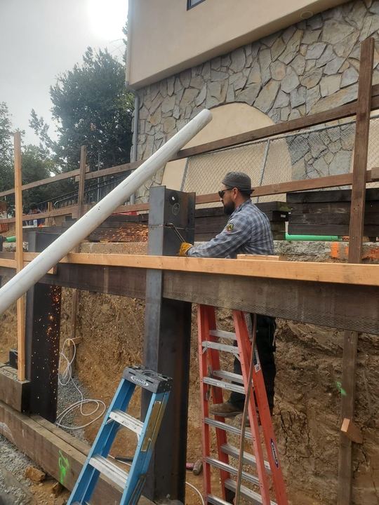 Exterior beam installation, welding, and steel connection support.