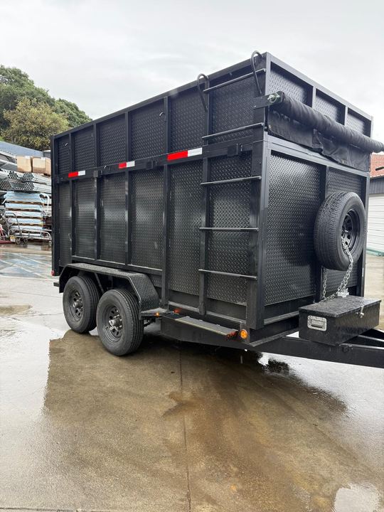 Custom fabricated trailer extension that raised the dump trailer walls for more hauling capacity.