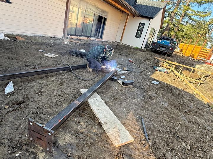 Welded posts, supports, base plates, and job-site metal components.