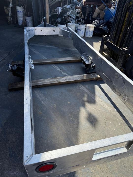 Welded trailer deck, frame, panel, and utility support repairs.