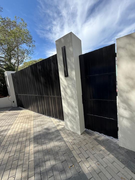 Custom welded gate panels, posts, frames, and entry metalwork.