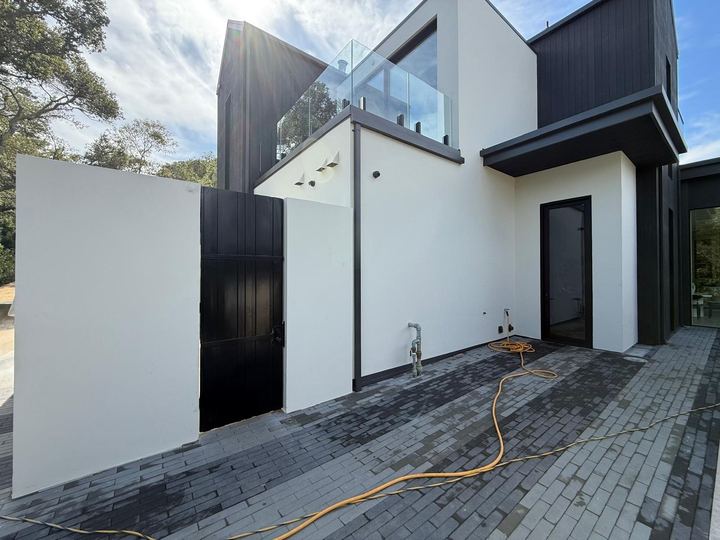Welded security gate and side-yard access metalwork for residential sites.
