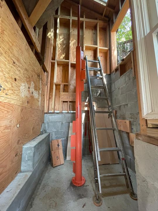 Custom fabricated steel support built for stairs with welded framing and fit-up details.